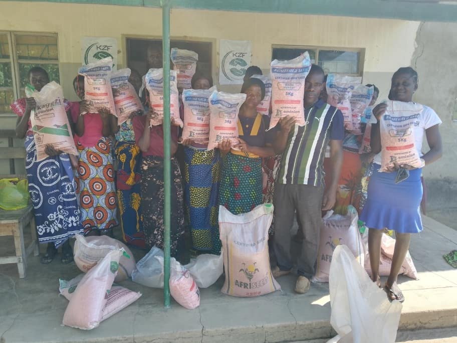Women posing for a photo after having received their seeds
