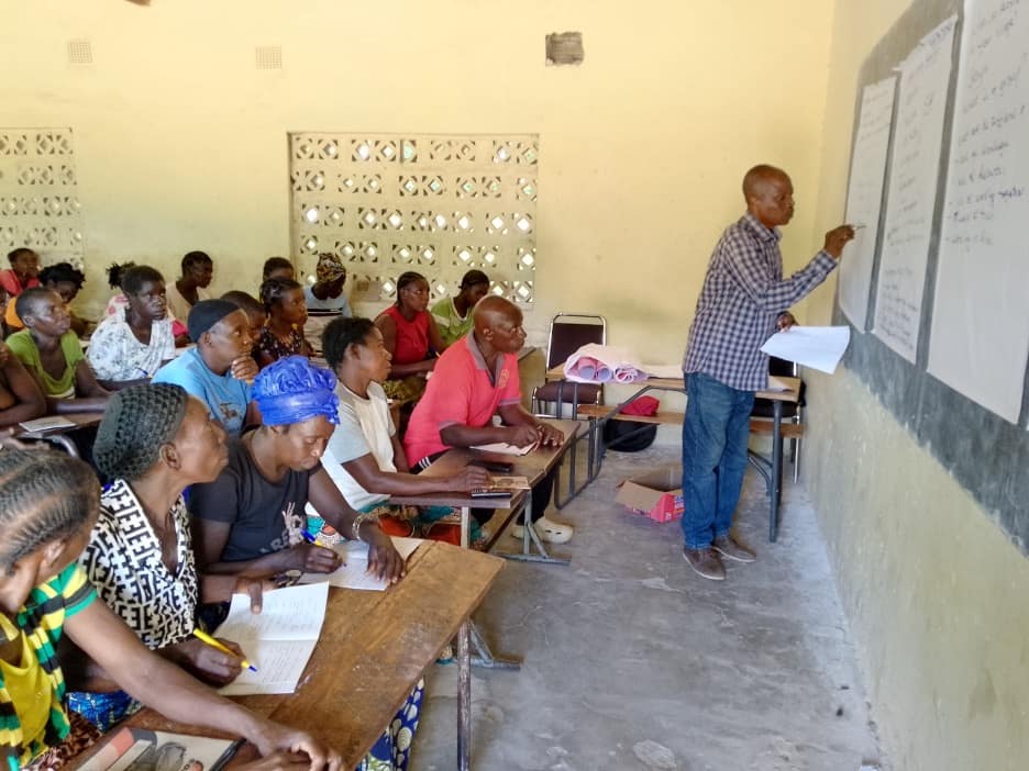 Women group attending a financial digitalisation training at Kawaya Primary School in Kawaya ward