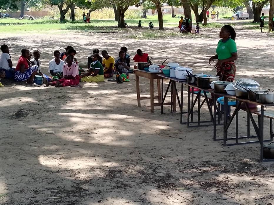 Women displaying food stuffs during the demonstration on nutritious food cooking for the women group 