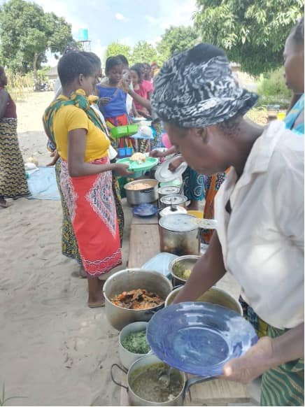 Women testing varies food dishes in Silembe